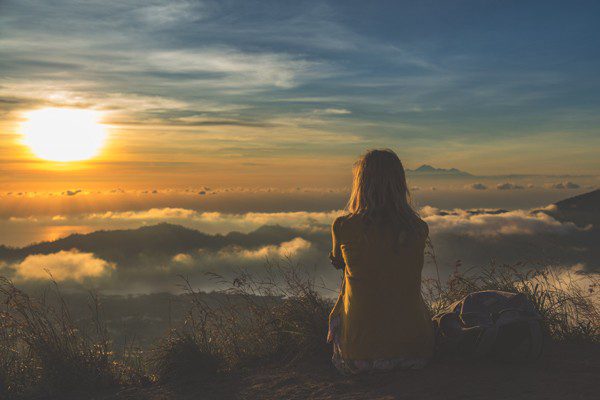 Girl watching the sunrise from mount Batur Bali Indonesia, Order of Bards, Ovates & Druids.